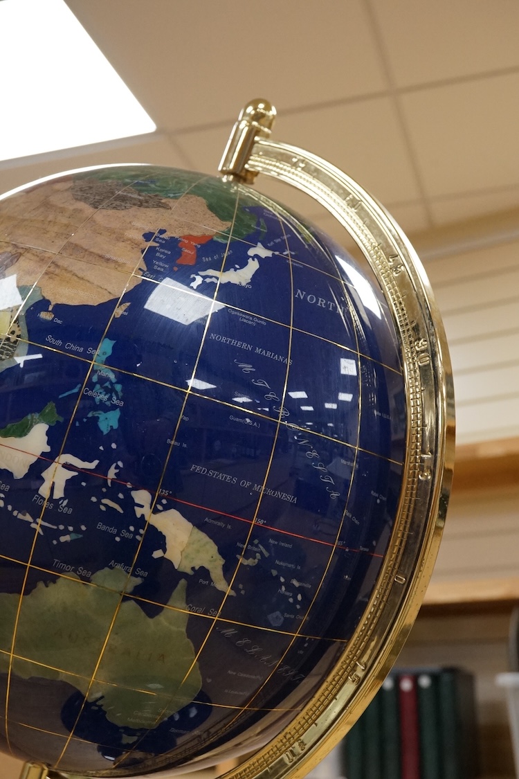 A large table top hardstone overlaid globe, 62cm high